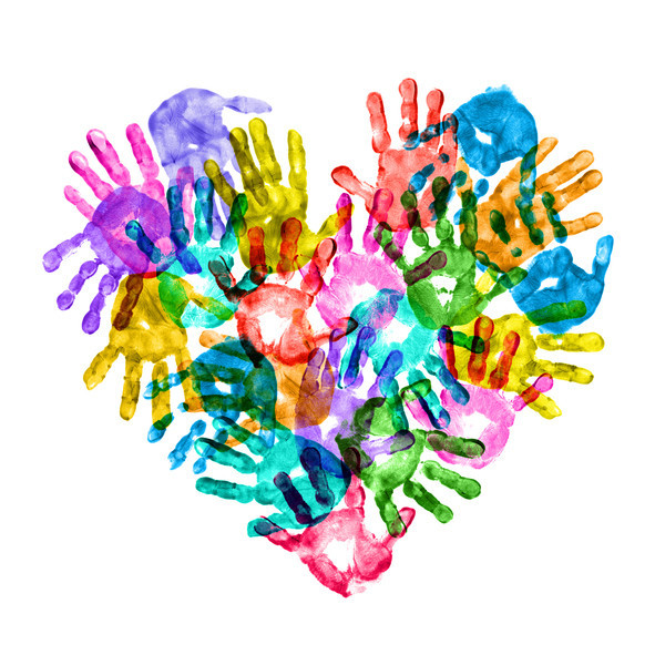 Colorful handprints from children arranged in a heart shape